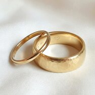 Handcrafted 14k yellow gold wedding rings with hammered texture