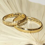 Handcrafted 14k yellow gold wedding rings with hammered texture and polished surface
