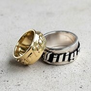 Handcrafted personalized wedding rings in silver and gold with names