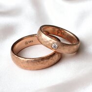Handcrafted 14k red gold wedding rings with hammered surface