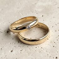 Handcrafted 14k yellow gold wedding rings with diamond setting