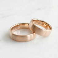 Handcrafted minimalist gold wedding rings with matte finish