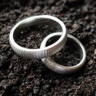 Handcrafted 14k white gold wedding rings with fabric-inspired texture