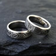 Handcrafted 14k white gold wedding rings with floral exterior engraving