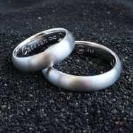 Two handcrafted 14k white gold wedding rings with satin matte finish