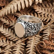 Handcrafted sterling silver signet ring with ornate baroque-style band and polished face