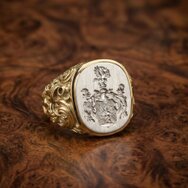 Handcrafted gold and white gold signet ring with finely engraved family crest