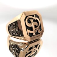 Handcrafted 18k rose gold signet ring with raised SR monogram and heraldic details
