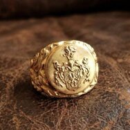 Handcrafted 18k gold signet ring with detailed engraved family crest