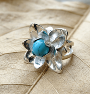 Handcrafted sterling silver lotus flower ring with turquoise gemstone
