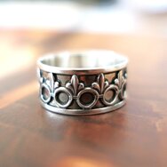 Handcrafted 925 sterling silver band ring with repeating Fleur-de-Lis ornament
