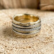 Handcrafted 14k yellow gold band ring with hammered texture and organic wave design