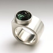 Handcrafted silver ring with large round green tourmaline and wide matte band