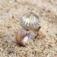 Handcrafted Mokume Gane ring with rutilated quartz and visible golden needle inclusions