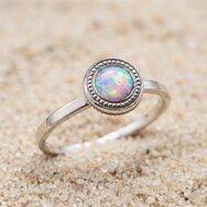 Handcrafted 14k white gold ring with shimmering opal cabochon
