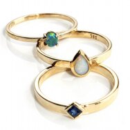 Handcrafted 14k yellow gold stacking rings with delicate gemstone accents