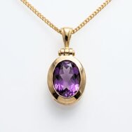 Handcrafted 14k rose gold pendant with oval amethyst in a classic elegant setting
