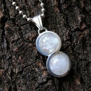 Handcrafted silver infinity pendant with round rock crystal gemstones