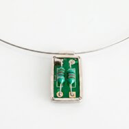 Handcrafted silver pendant with a genuine green circuit board piece set in silver