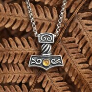 Massive dark Thor’s hammer pendant in Celtic style with Baltic amber
